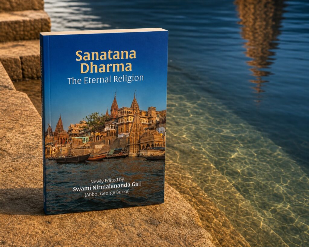 Sanatana Dharma: The Eternal Religion paperback beside the Ganges in Varanasi