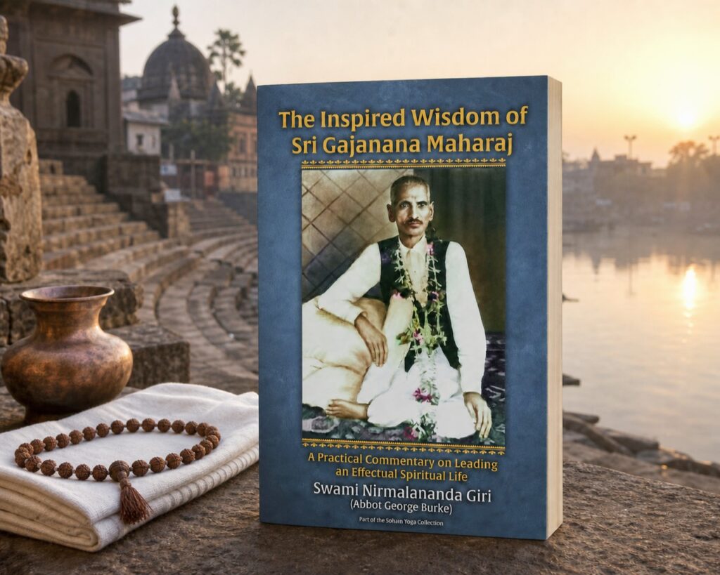 The Inspired Wisdom of Sri Gajanana Maharaj trade paperback beside a riverside ghat at sunrise