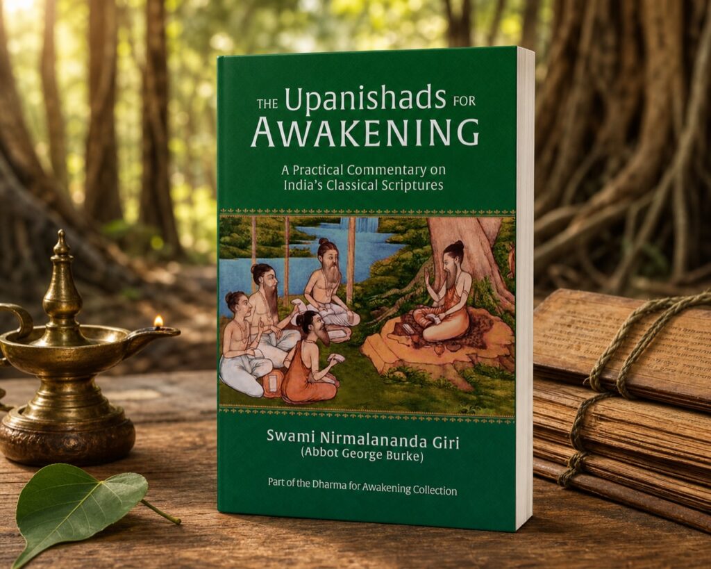 The trade paperback of The Upanishads for Awakening beside a lamp and palm-leaf manuscripts in a forest setting