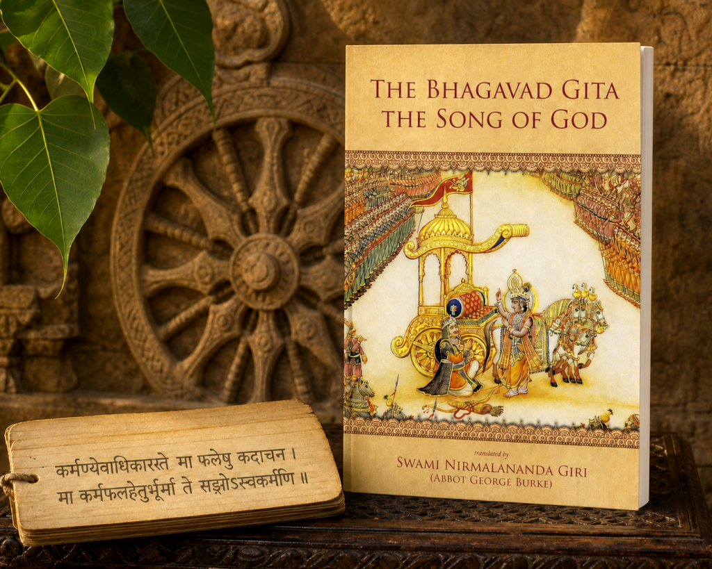 The Bhagavad Gita—The Song of God displayed beside an Indian manuscript and carved sacred wheel